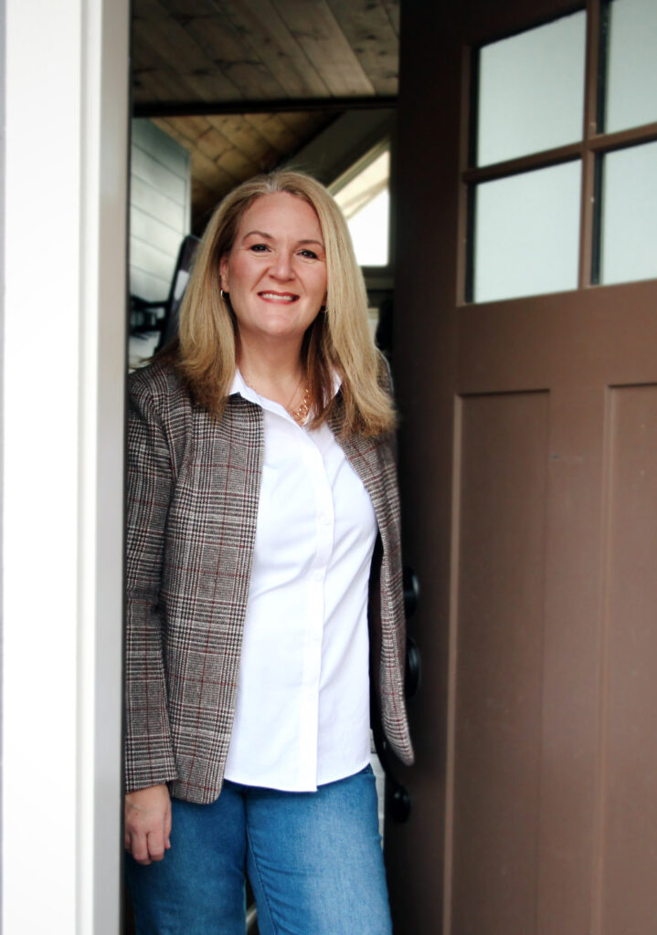 Agent at door of sold home, real estate, homes and property in North Georgia and Western North Carolina.