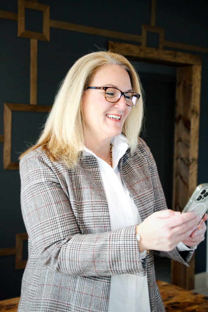 Agent reading text on phone, real estate, homes and property in North Georgia and Western North Carolina.